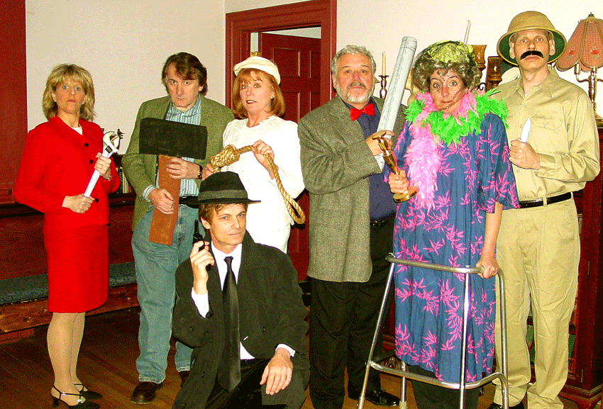 Standing: Cheryl Saseen as Miss Scarletta, Michael Ramsey as Mr. Greenjeans, Arlene Merryman as Mrs. Whitebread, Gino Angelo as Proifessor Plumb-loco, Dee McCorkle as Mrs. Peacock-a-doodle-Doo, Bert Furioli as Colonel Ketchup. Front: Butch Maxwell as Elliot Brick