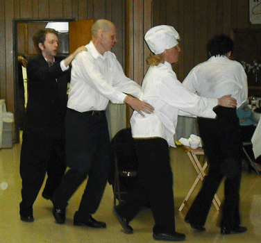 Orton, Fred, Ethel and Lucy form a conga line