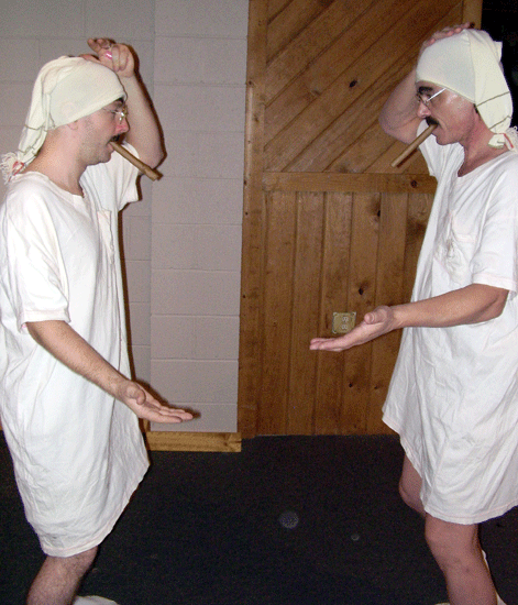 Ryan Sears (left) as Tin Man mocks Butch Maxwell (right) as Scarecrow.